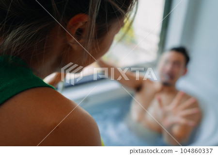 Funny playful asian couple lover play in the bathtub in the bathroom. 104860337