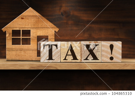 Wooden Text Tax! and Small Model House on a Shelf Wooden Text Tax! and Small Model House on a Shelf 104865310