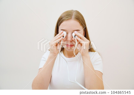 A patient on a magnetotherapy procedure on the nose 104865545