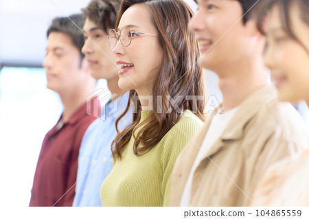 A young business woman who stretches her back and speaks out 104865559