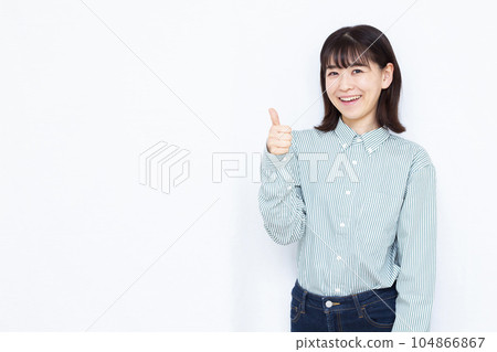 A woman in her thirties doing a good sign in front of a white background A woman in her thirties doing a good sign in front of a white background 104866867