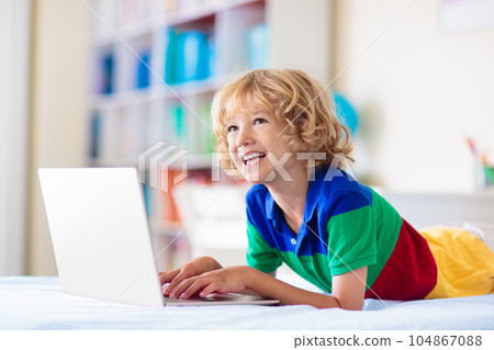 Online remote learning. School kids with computer. 104867088