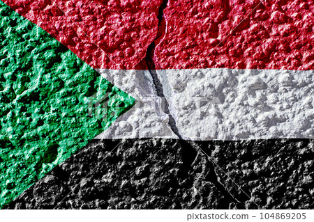 Flag of Sudan on the background of a plastered wall with a crack. Military insurgency and civil war in Sudan 104869205