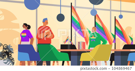 mix race businesspeople with lgbt rainbow flags gay lesbian love parade pride festival transgender love concept 104869467