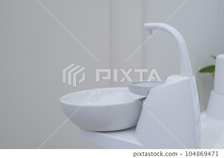 Dental cuspidor used for patients when they have to rinse their mouth Dental cuspidor used for patients when they have to rinse their mouth 104869471