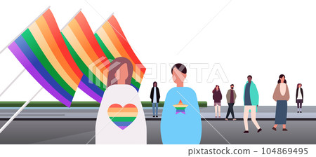 mix race people with lgbt rainbow flags gay lesbian love parade pride festival transgender love concept 104869495