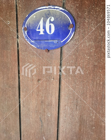 Close up of an house door number 46 Close up of an house door number 46 104869571