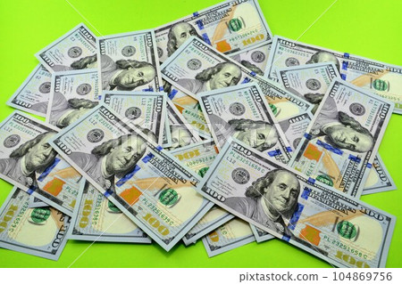 Background of many dollar bills. 104869756
