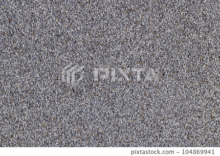 a close-up of a pile of poppy seeds used in cooking a close-up of a pile of poppy seeds used in cooking 104869941