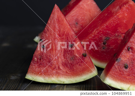 Sliced sweet watermelon of red color Sliced sweet watermelon of red color 104869951