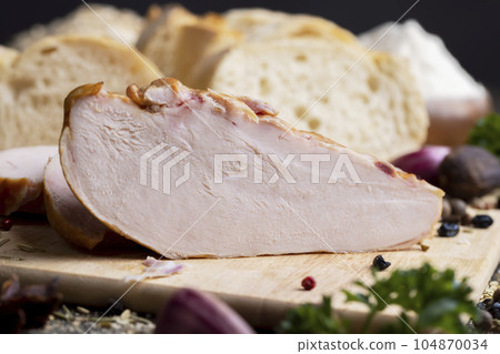 Smoked chicken breast with spices Smoked chicken breast with spices 104870034