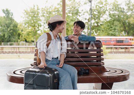 Asian couple at railway station have happy moment. Tourism and travel in the summer 104870168