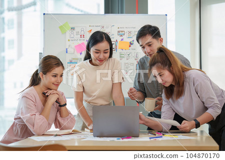 Young developer and ui designer brainstorming interface wireframe design.Creative digital development agency Young developer and ui designer brainstorming interface wireframe design.Creative digital development agency 104870170