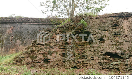 decayed stone wall 104871545