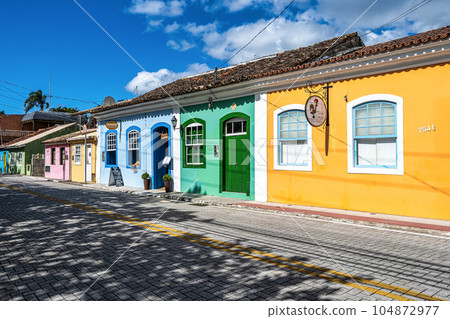 Colorful houses in colonial Portuguese architecture in Ribeirao da Ilha, Florianopolis, Santa Catarina, Brazil. 104872977