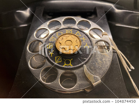 Stockholm, Sweden - June 11, 2023. Vintage old rotary telephone. Classical wired telephone. 104874450