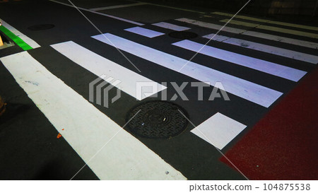 Scenery of a pedestrian crossing in the night image Scenery of a pedestrian crossing in the night image 104875538