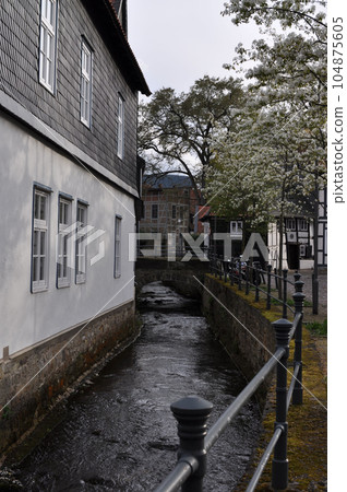 Vertical shot of river Gose or Abzucht between houses in Goslar, Germany Vertical shot of river Gose or Abzucht between houses in Goslar, Germany 104875605
