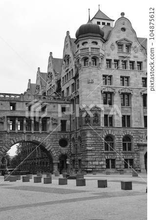 Vertical shot of New City Hall in Leipzig, Germany shot in grayscale Vertical shot of New City Hall in Leipzig, Germany shot in grayscale 104875612