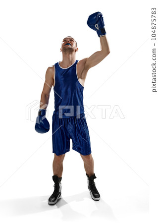 Full-length image of young sportive man , professional boxer in uniform and gloves standing isolated over white background Full-length image of young sportive man , professional boxer in uniform and gloves standing isolated over white background 104875783