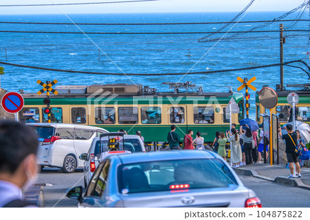 Kamakura cityscape in Japan Pilgrimage boom again, Enoshima Electric Railway / Kamakura High School Mae No. 1 railroad crossing crowded with tourists visiting Japan 104875822