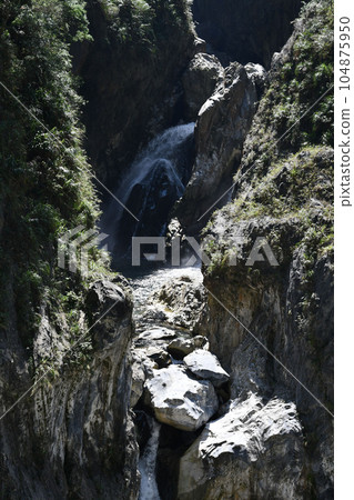 Vertical of a waterfall and ravine at Tianxiang recreation area in Xiulin township, Taiwan. 104875950