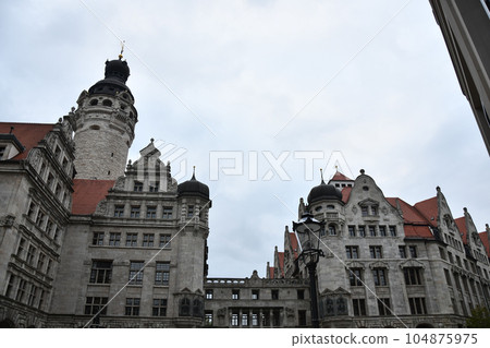 Low angle shot of New City Hall in Leipzig, Germany against a cloudy sky Low angle shot of New City Hall in Leipzig, Germany against a cloudy sky 104875975