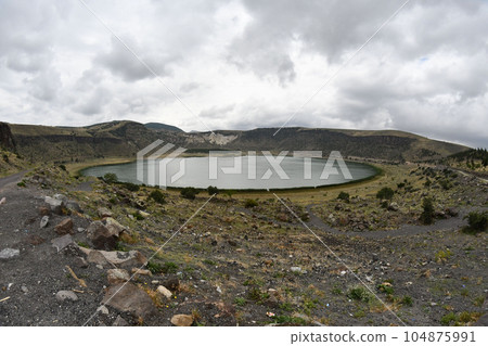 Beautiful view of Acigol salt lake under the cloudy sky, Denizli, Aegean region, Turkey Beautiful view of Acigol salt lake under the cloudy sky, Denizli, Aegean region, Turkey 104875991