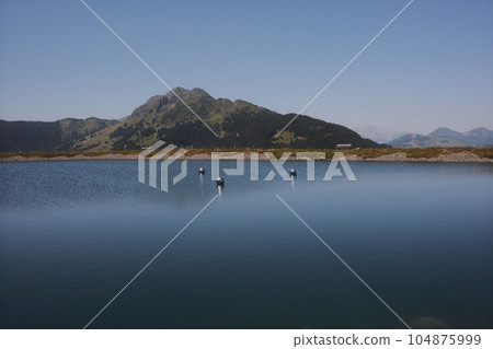 Beautiful alpine summer view with a lake at the famous Asitz summit, Leogang, Salzburg, Austria Beautiful alpine summer view with a lake at the famous Asitz summit, Leogang, Salzburg, Austria 104875999