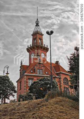 Vertical shot of an old port office in Dortmund, Germany Vertical shot of an old port office in Dortmund, Germany 104876050
