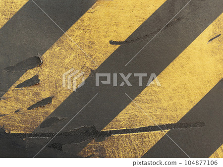 Worn weathered surface with diagonal yellow and black stripes. Nice image with dynamic elements, Color combination creates bold and striking contrast. Urban and industrial design. 104877106