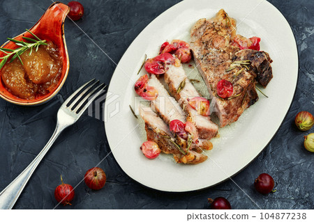 Beef steak with berry sauce. 104877238