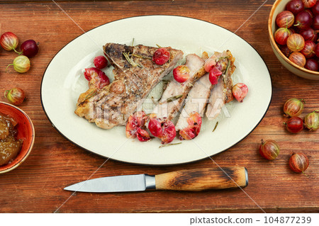 Beef steak with berry, bbq food. 104877239