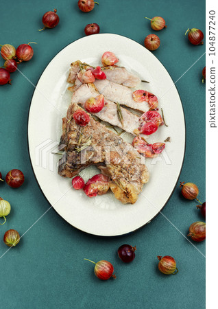 Beef steak with berry sauce. 104877240