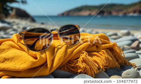 Beautiful sunglasses by the sea or ocean, hot weather, vacation and a weekend Beautiful sunglasses by the sea or ocean, hot weather, vacation and a weekend 104877972