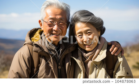 Smiling Japanese husband and wife, married couple in the nature background, traveling 104878063