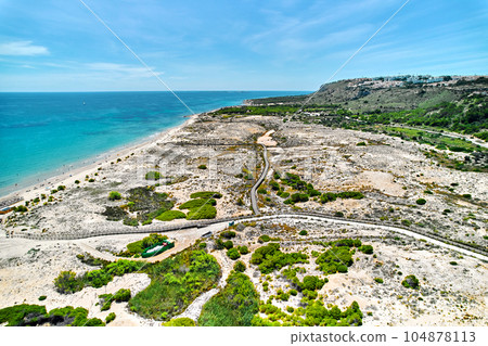 Drone point of view of sandy beach of Gran Alacant 104878113