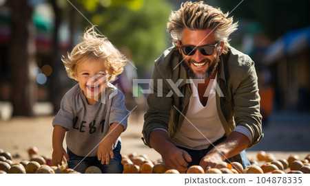 Portrait of a father playing and walking with his young son, parenthood 104878335