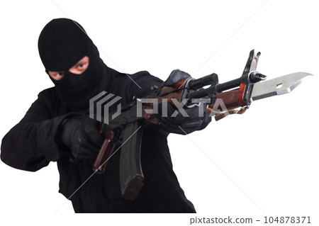 A man in a black uniform attacks with a bayonet. A man in a black uniform attacks with a bayonet. 104878371