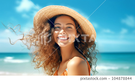 Portrait of a beautiful girl with long loose hair on the beach in front of the sea 104878844