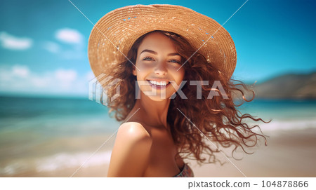 Portrait of a beautiful girl with long loose hair on the beach in front of the sea 104878866