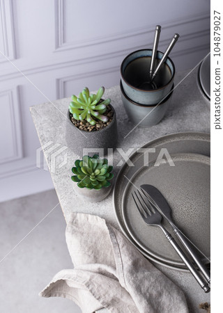 Craft ceramic plates, bowls and cups 104879027