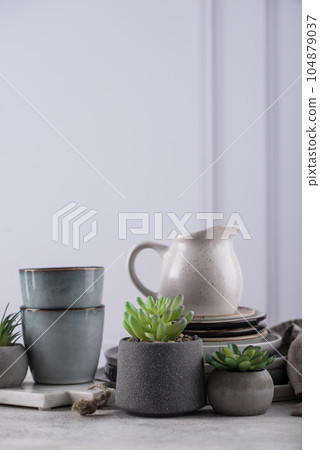 Craft ceramic plates, bowls and cups 104879037