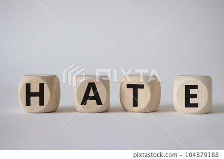 Hate symbol. Concept word Hate on wooden cubes. Beautiful white background. Business and Hate concept. Copy space. Hate symbol. Concept word Hate on wooden cubes. Beautiful white background. Business and Hate concept. Copy space. 104879188