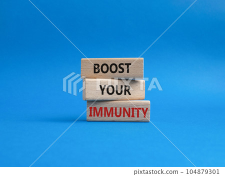 Boost your immunity symbol. Concept word Boost your immunity on wooden blocks. Beautiful blue background. Helthcare and Boost your immunity concept. Copy space 104879301