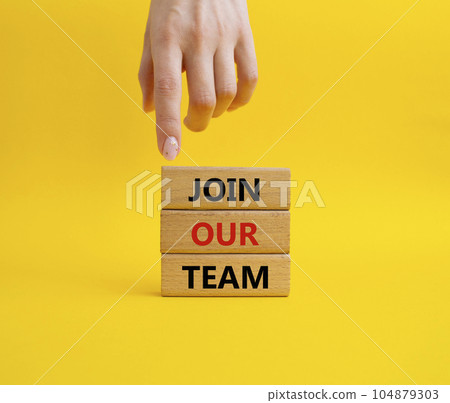 Join our team symbol. Wooden blocks with words Join our team. Beautiful yellow background. Businessman hand. Business and Join our team concept. Copy space. 104879303