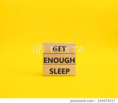 Get enough sleep symbol. Wooden blocks with words Get enough sleep. Beautiful yellow background. Healthy lifestyle, medical and Get enough sleep concept. Copy space. 104879317