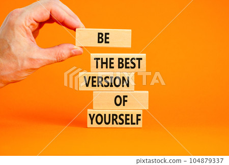 Motivational inspirational symbol. Concept words Be the best version of yourself on wooden block. Beautiful orange background Businessman hand. Business motivational inspirational concept. Copy space. Motivational inspirational symbol. Concept words Be the best version of yourself on wooden block. Beautiful orange background Businessman hand. Business motivational inspirational concept. Copy space. 104879337