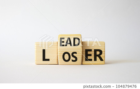 Leader vs Loser symbol. Wooden cubes with words Loser and Leader. Beautiful white background. Leader vs Loser and business concept. Copy space Leader vs Loser symbol. Wooden cubes with words Loser and Leader. Beautiful white background. Leader vs Loser and business concept. Copy space 104879476