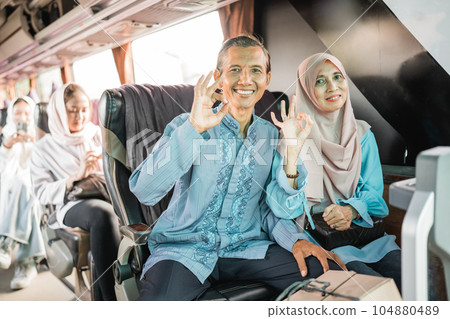 mature passenger smile showing thumb up sitting on the bus mature passenger smile showing thumb up sitting on the bus 104880489